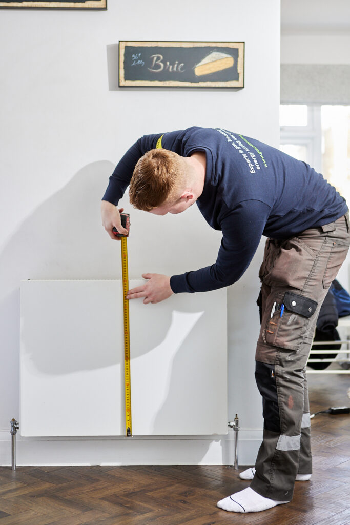 Engineer installing heating system